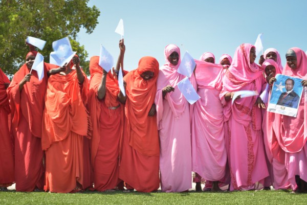 Women wave Somali flags during a celebration to mark Somalia's Independence Day at Konis stadium in Mogadishu on July 1. Today's celebrations mark 53 years since the Southern regions of Somalia gained independence from Italy and joined with the Northern region of Somaliland to create Somalia. AU UN IST PHOTO / TOBIN JONES.