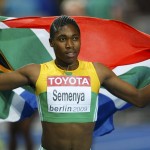Semenya of South Africa holds her national flag as she celebrate after the women’s 800 metres final during world athletics championships in Berlin