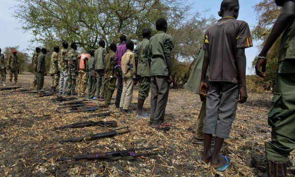 Children surrender their weapons during a ceremony formalizing their release from the SSDA Cobra Faction armed group, in Pibor, Jonglei State. On 10 February 2015 in South Sudan, UNICEF and partners oversaw the release of 300 children from the South Sudan Democratic Army (SSDA) Cobra Faction armed group, in Pibor, Jonglei State. The children surrendered their weapons and uniforms in a UNICEF-supported ceremony overseen by the South Sudan National Disarmament, Demobilization and Reintegration Commission and the Cobra Faction. They will spend their first night in an interim care centre, where they will be provided with food, water and clothing – and will also have access to health and psychosocial services. Their release follows that of an additional 249 children from Cobra Faction on 27 January, in the village of Gumuruk, Jonglei State. Since that time, 179 of the children have returned home to their families, while 70 children continue to live at the UNICEF-supported interim care centre as family tracing and reunification is carried out. All 249 boys attend the centre every day for meals, recreational activities and psychosocial support. Estimating that the cost for the release and reintegration of each child is approximately US$2,330 for 24 months, UNICEF is appealing for $13 million to fund the immediate needs of the released children and the vulnerable communities where they live. The children released on 27 January and 10 February are among approximately 3,000 in the Cobra Faction whose release has been secured by UNICEF and partners – in one of the largest ever such releases of children associated with armed groups or forces. The releases will continue in phases over the coming month. The released children and local communities have overwhelmingly told UNICEF that education is their number one priority. UNICEF is improving access to education in each of the release locations by either strengthening existing facilities or providing new schools where none ex