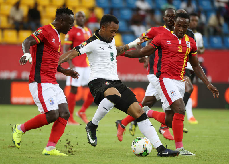 Tonny Mawejje of Uganda and Geofrey Kizito of Uganda (r) battles for the ball with Jordan Ayew of Ghana during the 2017 Africa Cup of Nations Finals football match between Ghana and Uganda at the Port Gentil Stadium in Gabon on 17 January 2017 ©Chris Ricco/BackpagePix