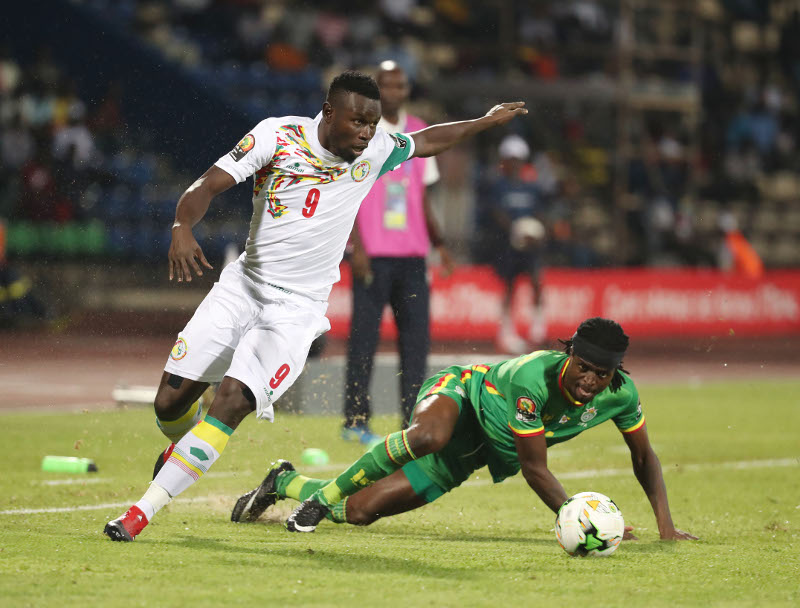 Mame Biram Diof of Senegal evades tackle from Costa Nhamoinesu of Zimbabwe during the 2017 African Cup of Nations Finals Afcon football match between Senegal and Zimbabwe at the Franceville Stadium in Gabon on 19 January 2017 ©Gavin Barker/BackpagePix