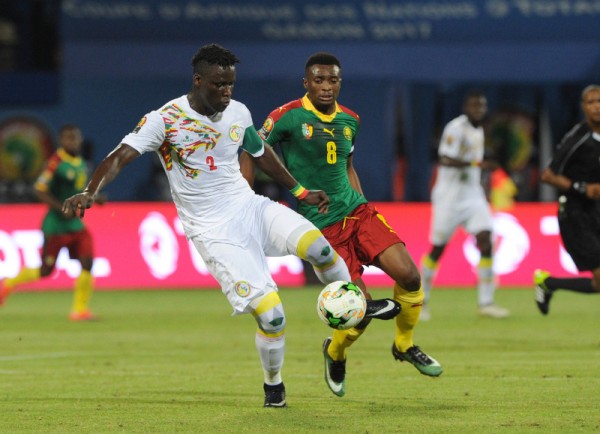 Serigne Mbodji of Senegal is challenged by Benjamin Moukandjo of Cameroon during the Afcon Quarter Final match between Senegal and Cameroon on the 28 January 2017 at Franceville , Gabon Pic Sydney Mahlangu/ BackpagePix
