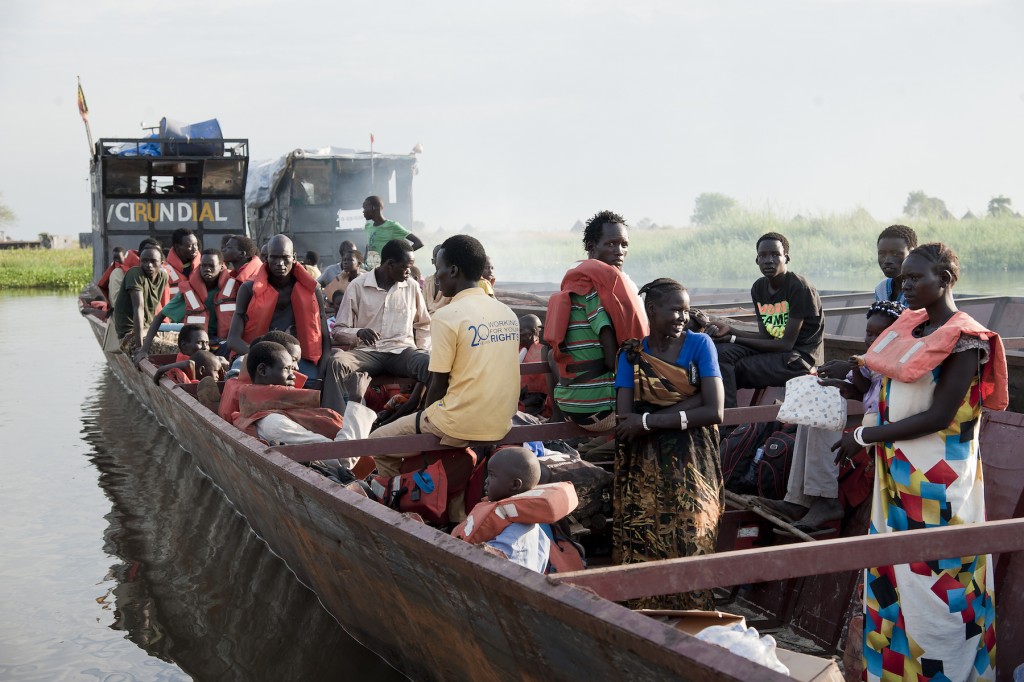 Ethiopia / South Sudanese Refugees / Over a hundred South Sudanese refugees in Matar in the Gambella Region of Ethiopia, near the border of South Sudan, board a boat to escape the floods and relocate to dry land at the Pugnido Refugee Camp eight hours away, on 17 November 2014.  UNHCR / Catianne Tijerina / November 2014